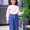 Girl wearing handblock printed capris