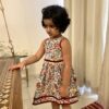 Girl in a floral dress in block printed cotton