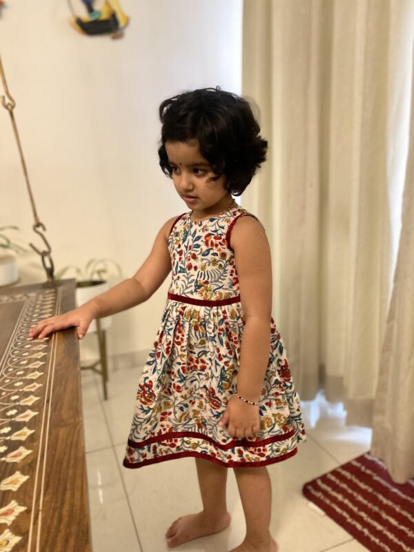 Girl in a floral dress in block printed cotton