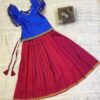 Traditional Attire and timeless charm in this blue and red pavadai sattai for girls