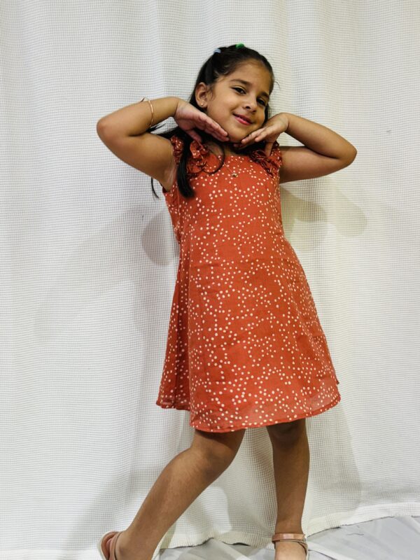 Little girl in mul cotton polka dot dress