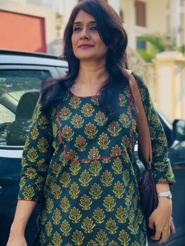 Woman wearing green ajrakh kurta for office