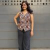 Ajrakh waist coat in white prints paired with black jeans