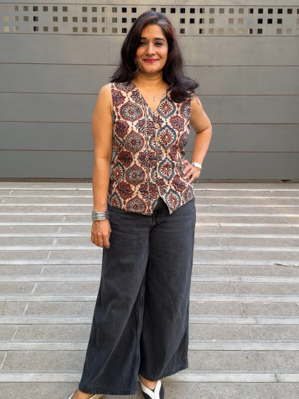 Ajrakh waist coat in white prints paired with black jeans